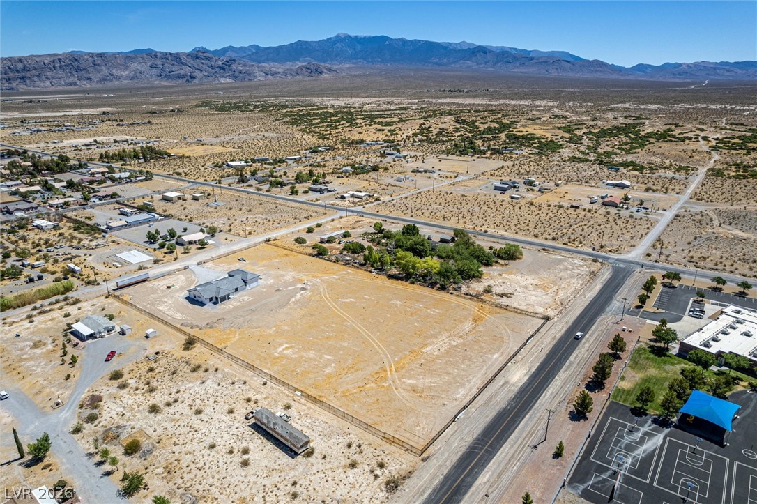 5910 East Kellogg Road Pahrump, NV 89061 - Photo 53 of 58 A vast, level lot provides ample space for custom development against a mountainous desert backdrop.