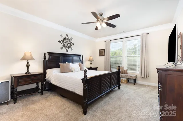 a bed room with a bed and a television