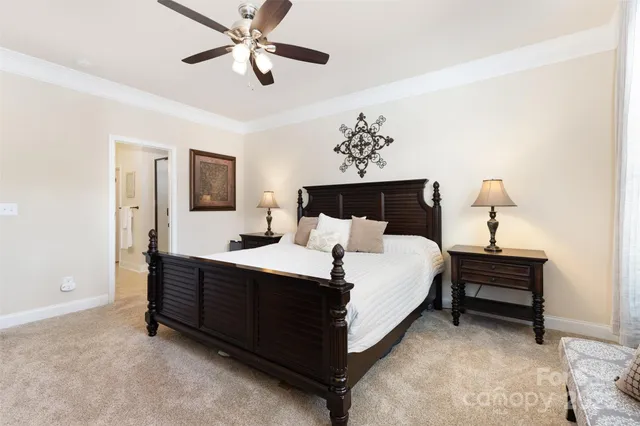 a bed room with a bed and a chandelier