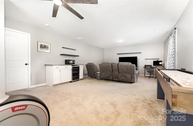 a living room with furniture and flat screen tv