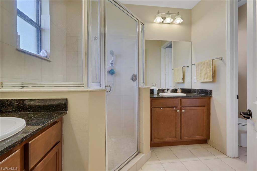 5289 Beckton Road Immokalee, FL 34142 - Photo 16 of 37 a kitchen with stainless steel appliances granite countertop a refrigerator and a stove