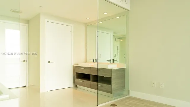 a bathroom with a sink and a mirror