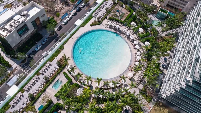 a bathroom with a mirror and a shower