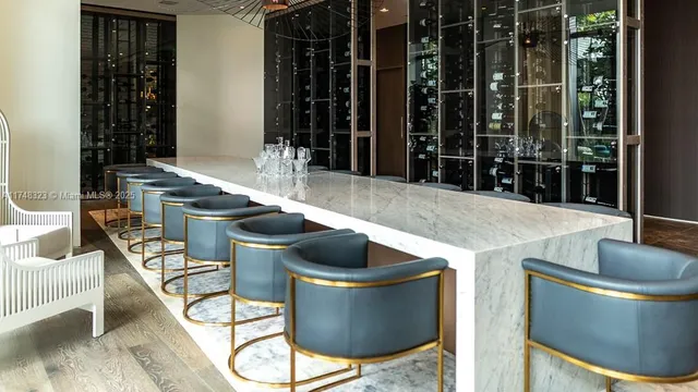 a media room with lots of chairs and a projector screen