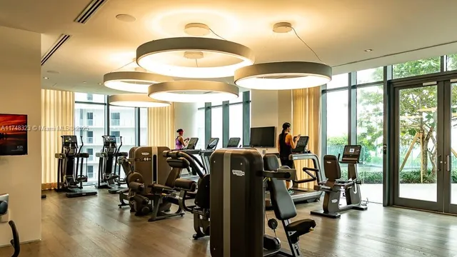 a media room with lots of chairs and a projector