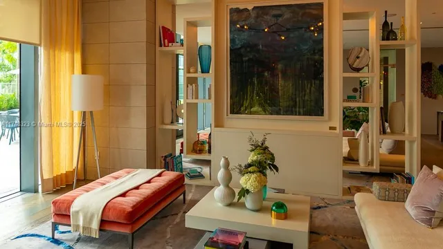 a view of a patio with a table and chairs and potted plants