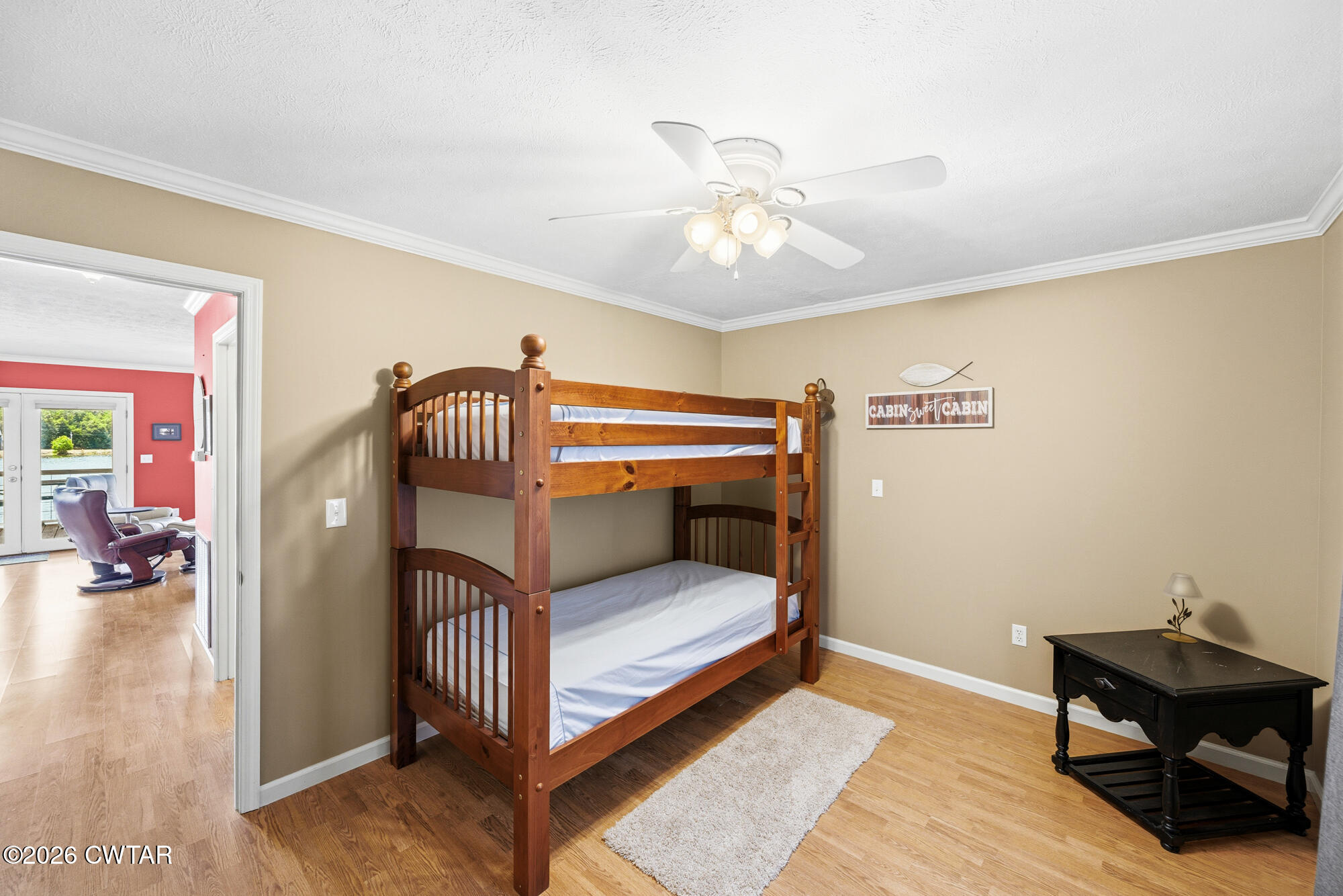 1728 Yarbro Landing Lane Decaturville, TN 38329 - Photo 14 of 44 a bedroom with a bed and a chandelier