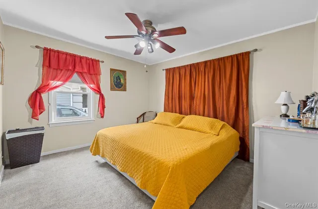 a bed sitting in a room next to a window