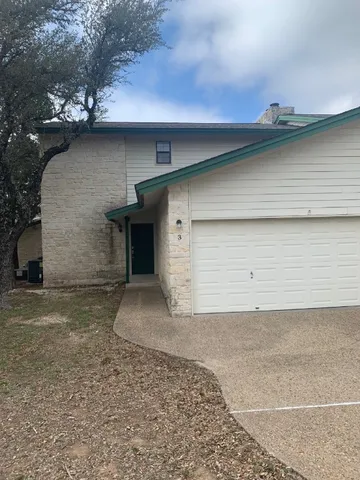 a front view of a house with a garage