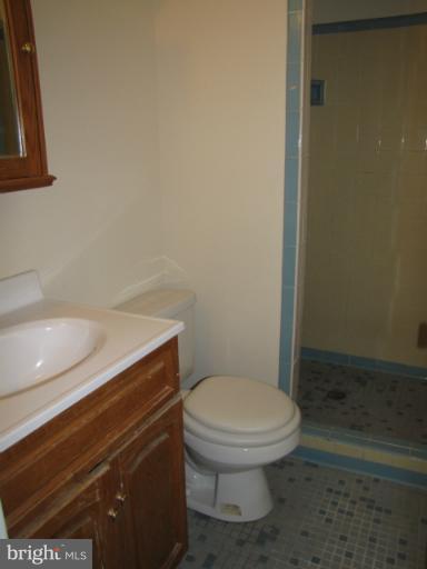 15411 Bond Mill Road Laurel, MD 20707 - Photo 11 of 26 a bathroom with a toilet and a sink