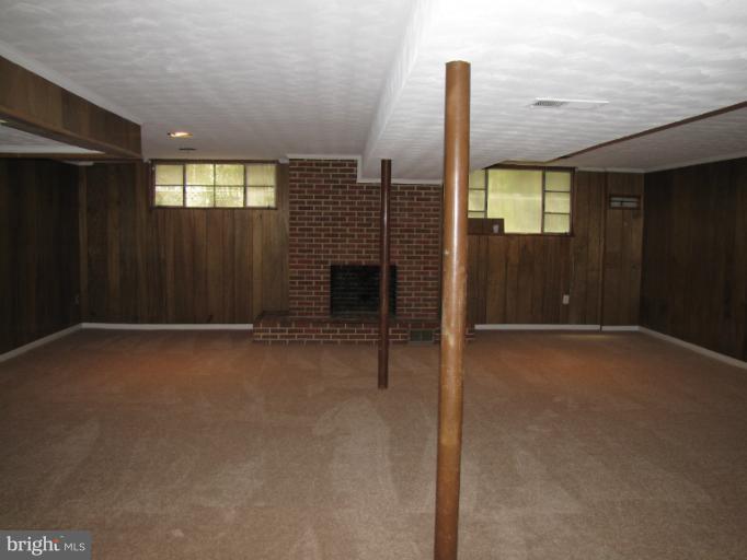 15411 Bond Mill Road Laurel, MD 20707 - Photo 8 of 26 a view of an empty room with a fireplace