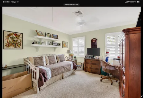 a bed room with a bed and a window