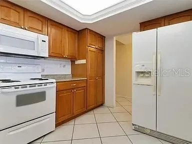 a spacious bedroom with a bed a window and closet
