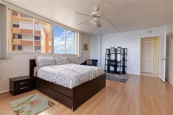 a kitchen with a sink window and cabinets