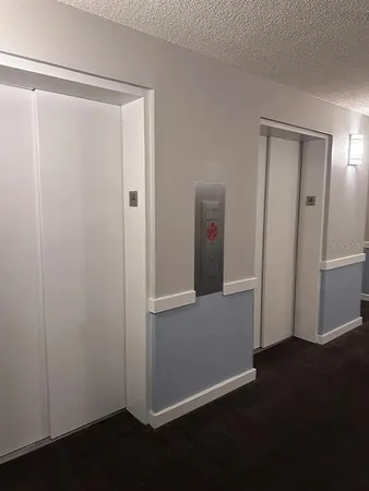 a kitchen with granite countertop a stove cabinets and a sink