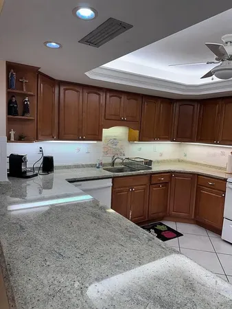 a utility room with dryer washer and sink