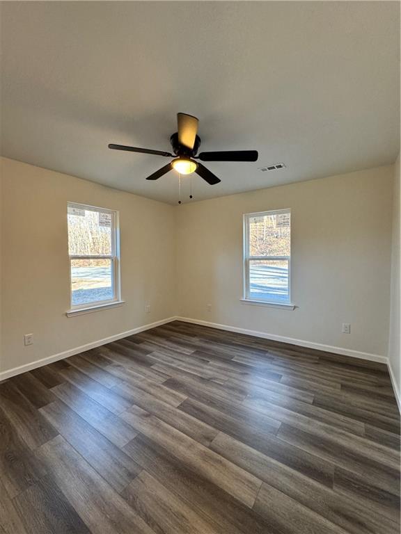 5120 South Dixie Highway Resaca, GA 30735 - Photo 11 of 14 a view of an empty room with wooden floor and a window