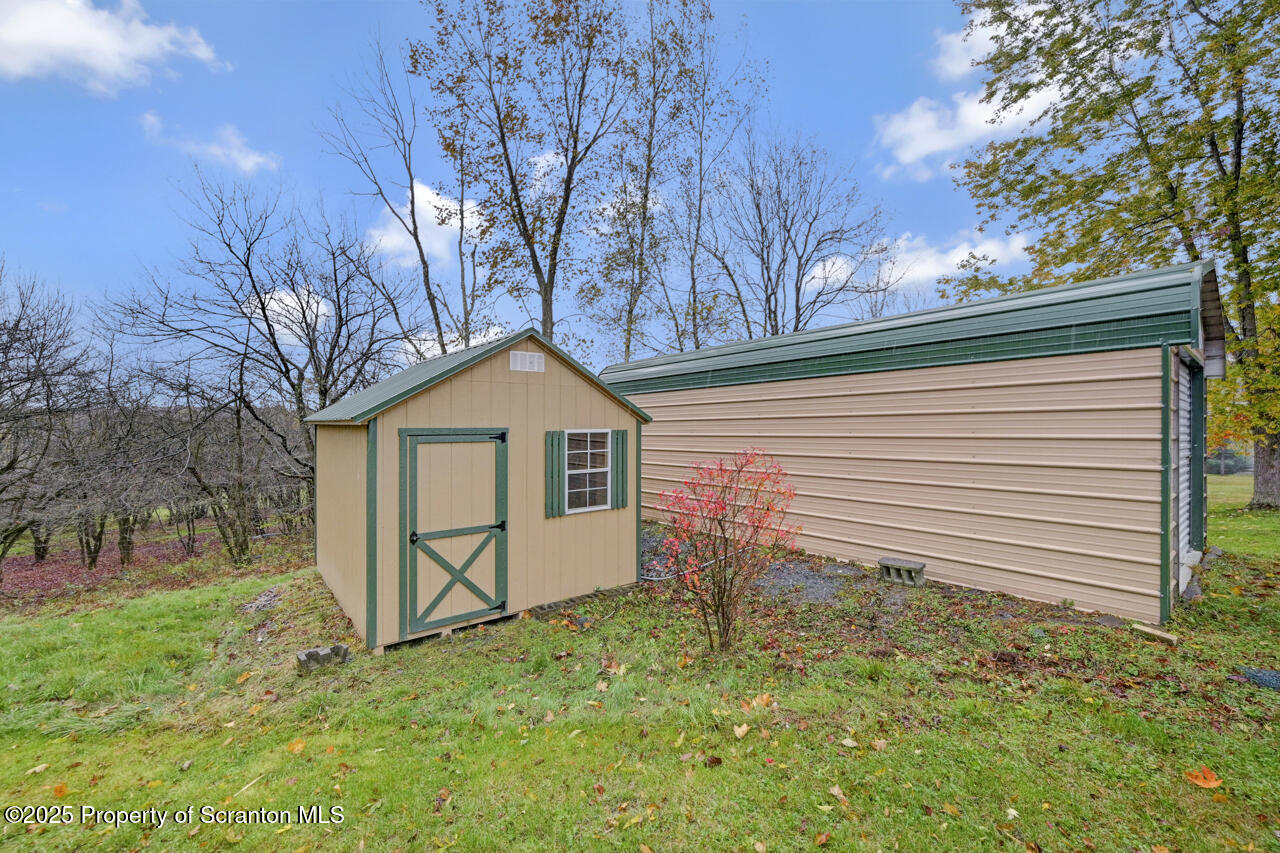 11 Mizianty Lane Waymart, PA 18472 - Photo 15 of 84 a white house that has tree in front of it