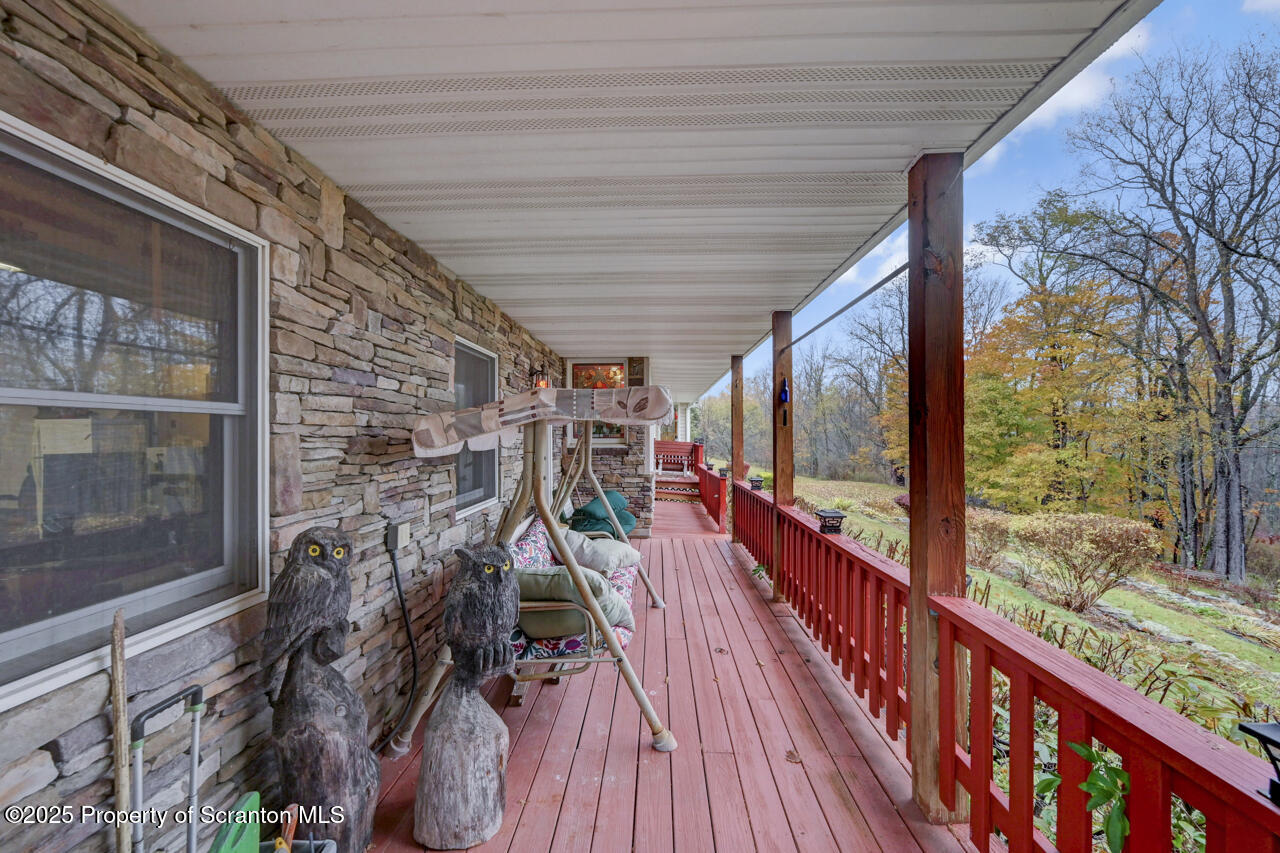 11 Mizianty Lane Waymart, PA 18472 - Photo 23 of 84 a view of a balcony with wooden floor