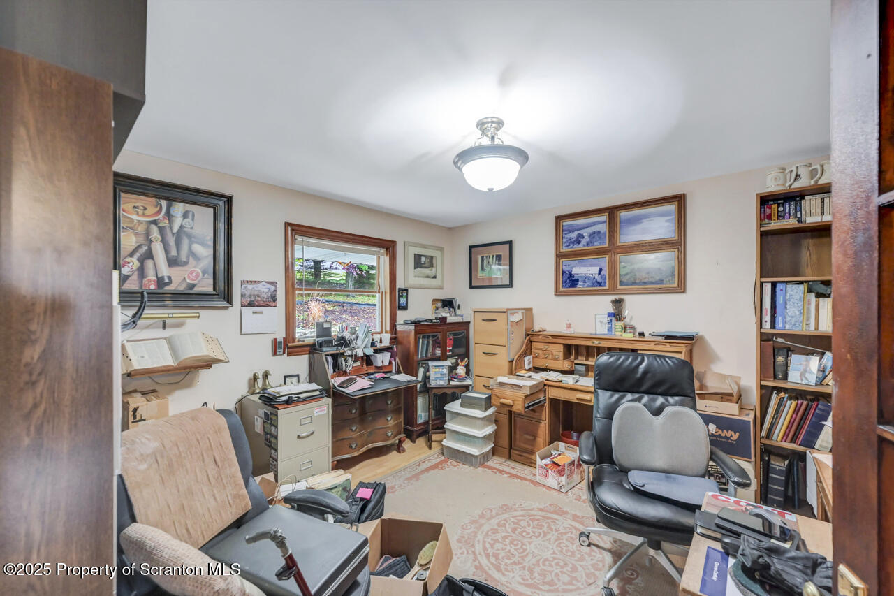 11 Mizianty Lane Waymart, PA 18472 - Photo 24 of 84 a living room with furniture and a bookshelf