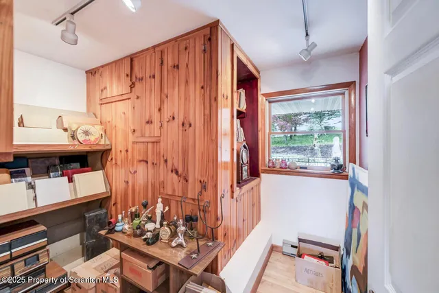 a view of a hallway view with wooden floor and staircase
