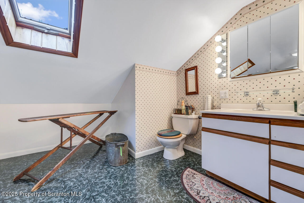 11 Mizianty Lane Waymart, PA 18472 - Photo 34 of 84 a bathroom with a toilet sink and mirror