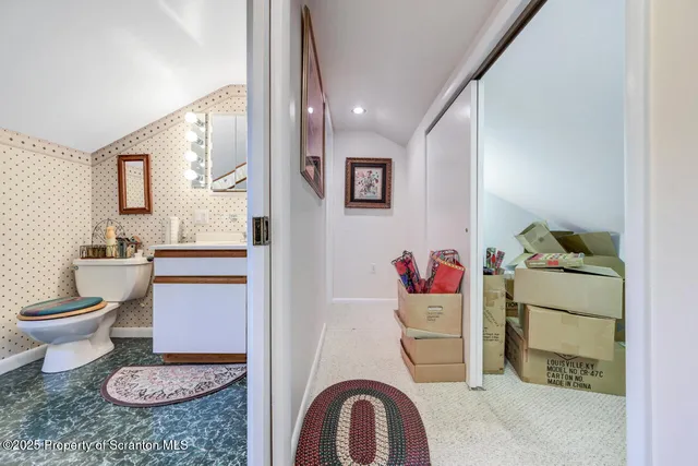 a bedroom with furniture and a large window