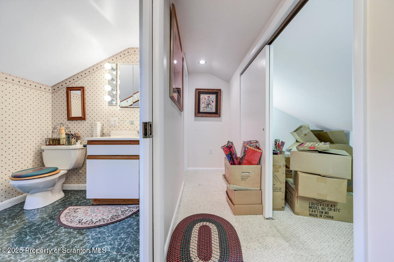 11 Mizianty Lane Waymart, PA 18472 - Photo 36 of 84 a bathroom with a toilet a sink and a mirror