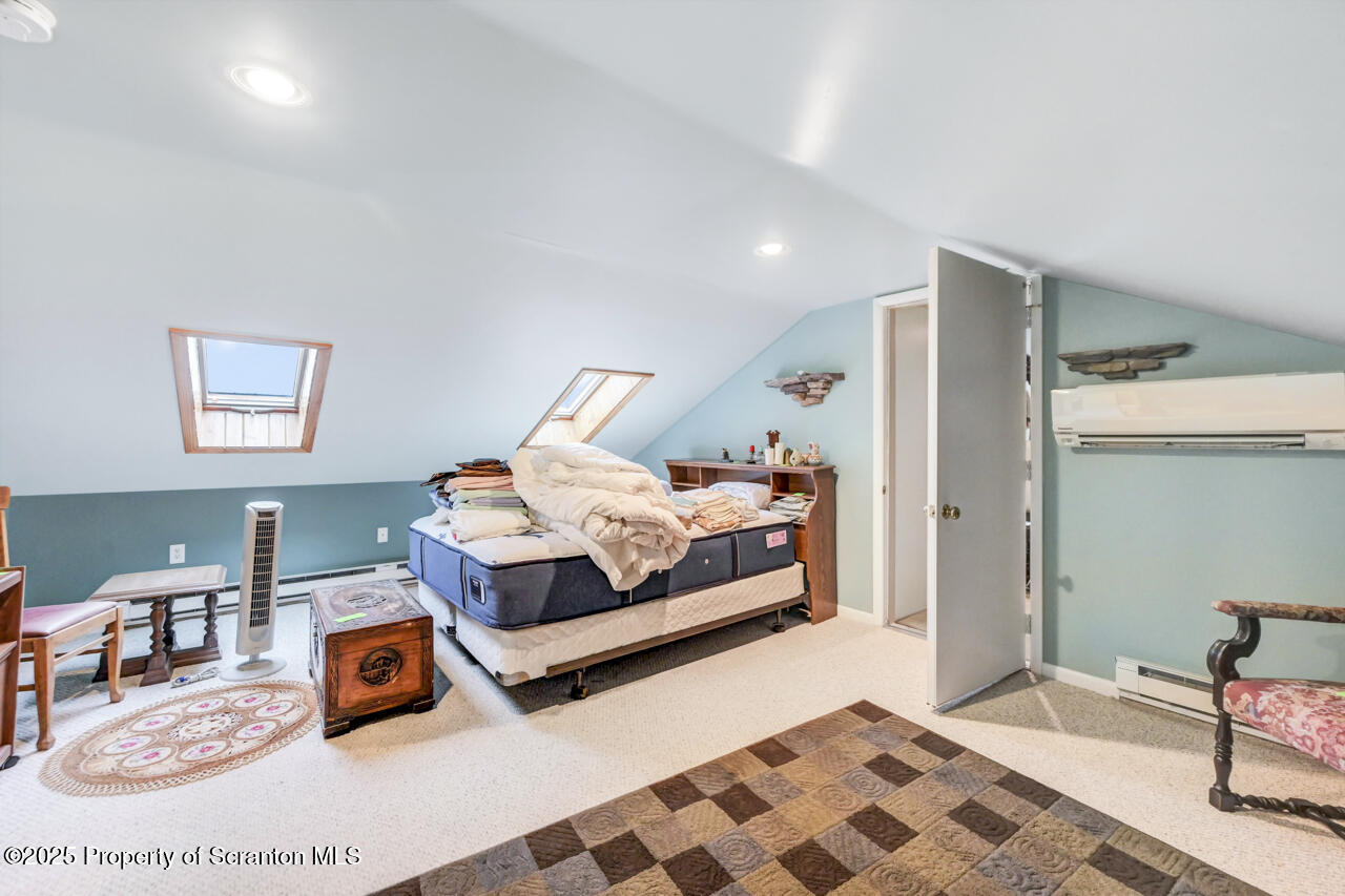 11 Mizianty Lane Waymart, PA 18472 - Photo 37 of 84 a bedroom with a bed and wooden floor