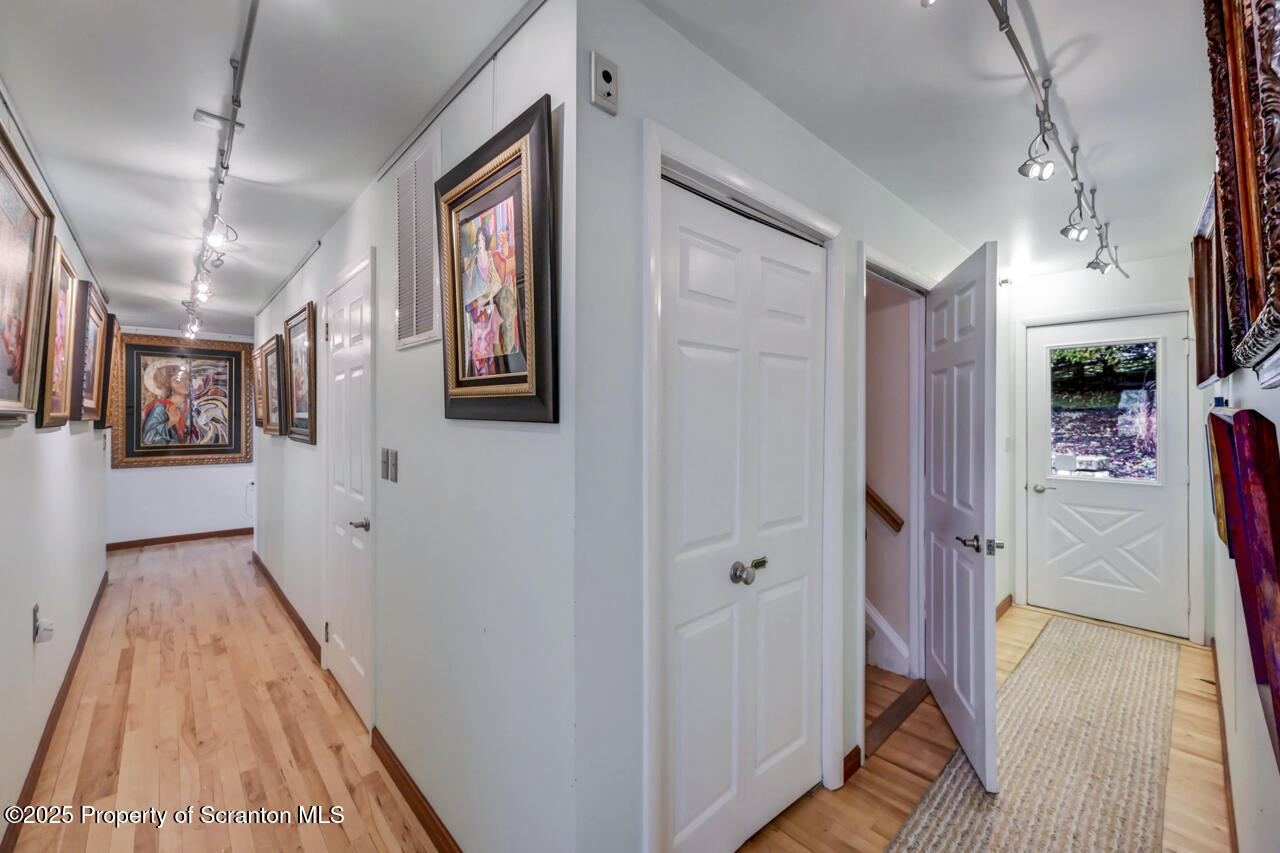 11 Mizianty Lane Waymart, PA 18472 - Photo 51 of 84 a view of a hallway view with wooden floor and staircase