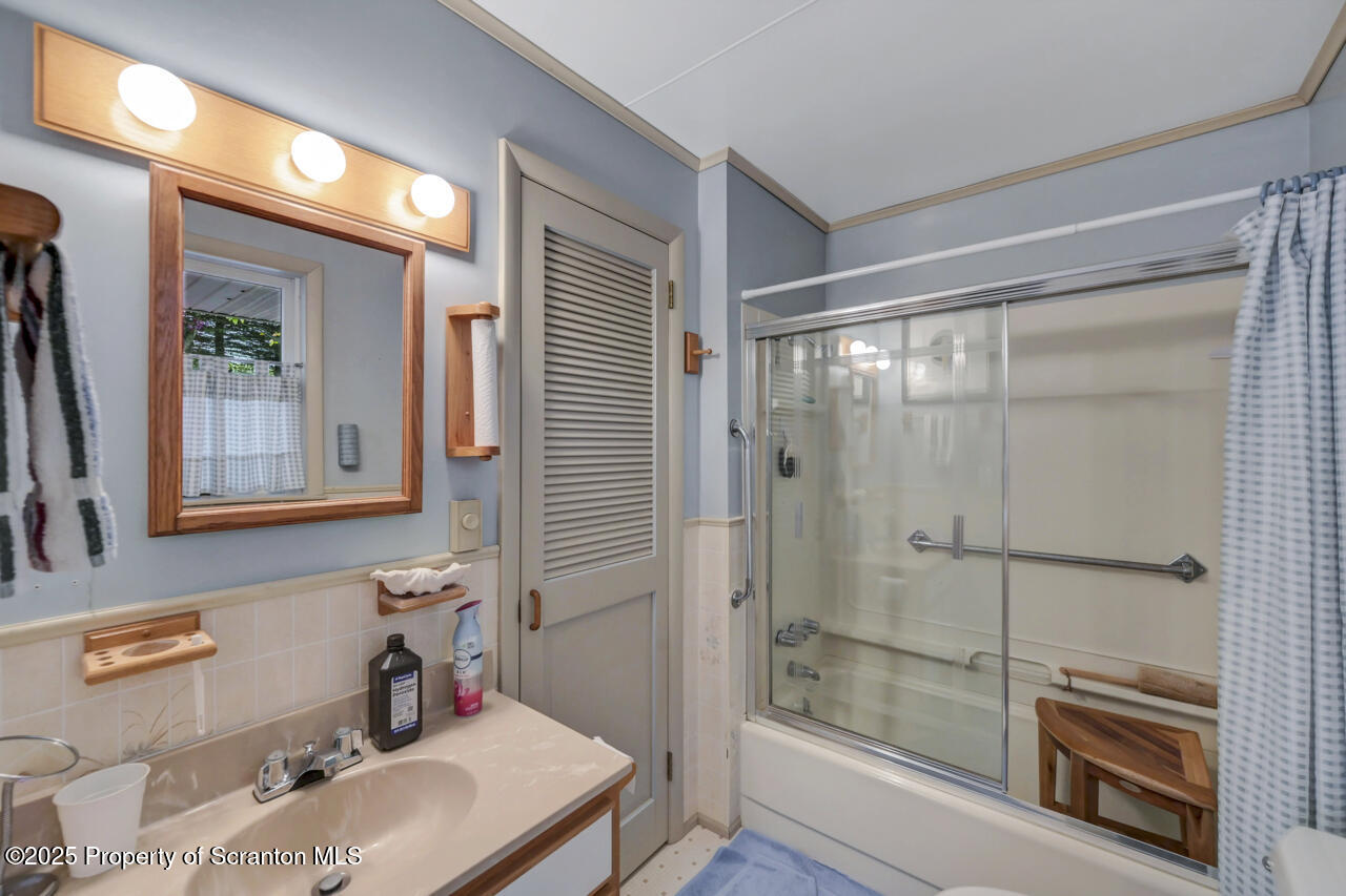 11 Mizianty Lane Waymart, PA 18472 - Photo 52 of 84 a bathroom with a sink and a mirror