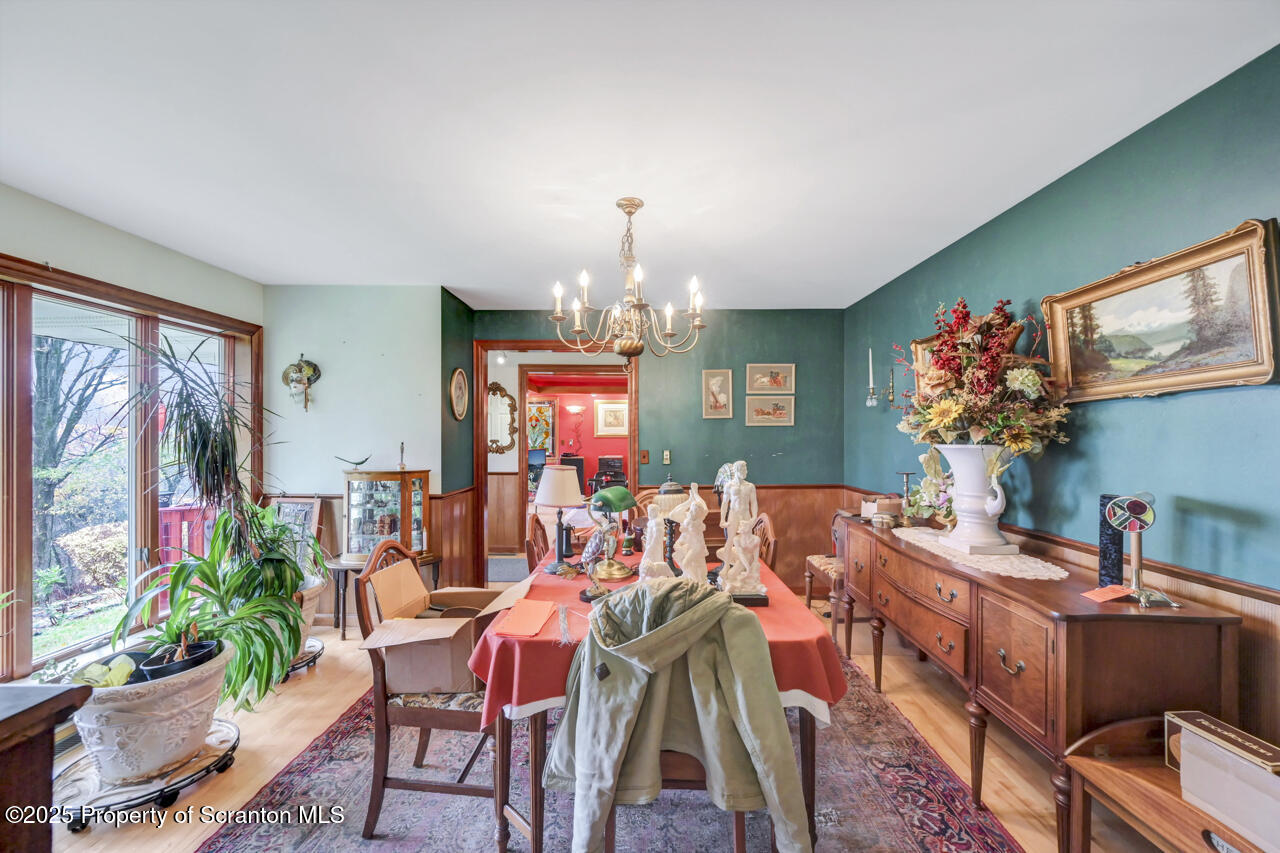 11 Mizianty Lane Waymart, PA 18472 - Photo 70 of 84 a view of a dining room with furniture a livingroom and chandelier