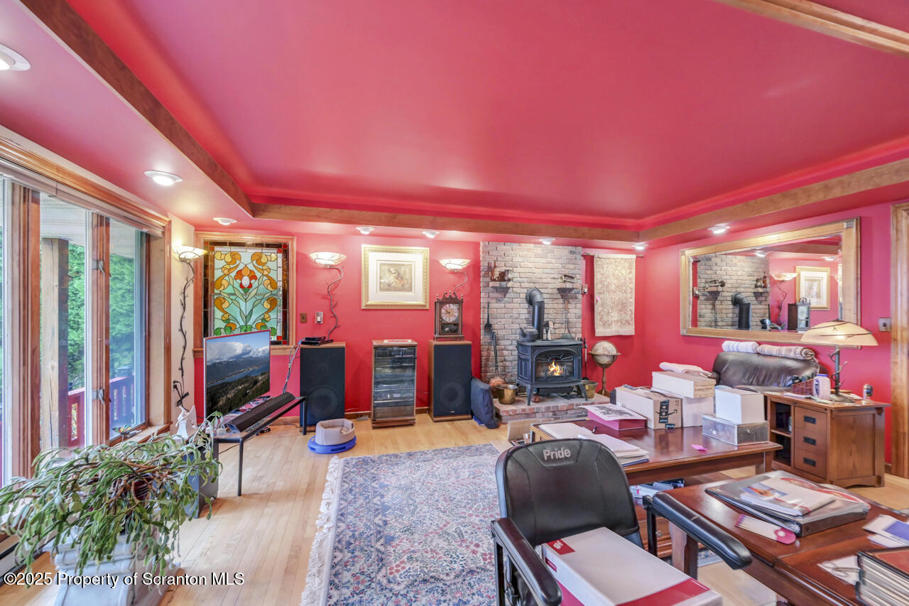 11 Mizianty Lane Waymart, PA 18472 - Photo 74 of 84 a living room with furniture a rug and a potted plant