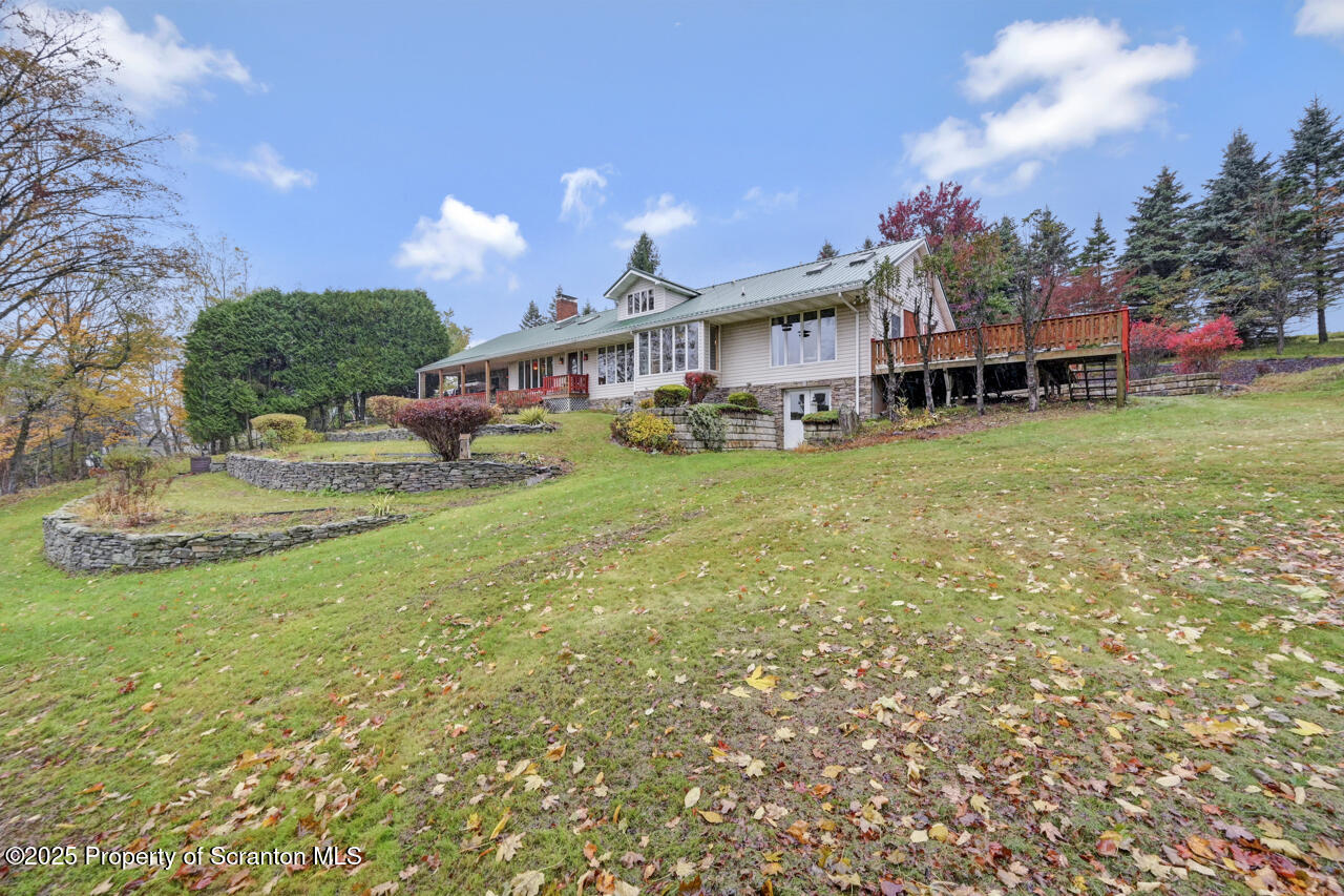 11 Mizianty Lane Waymart, PA 18472 - Photo 84 of 84 a view of a house with a yard porch and sitting area