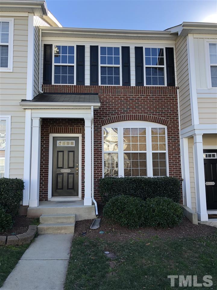 7857 Spungold Street Raleigh, NC 27617 - Photo 1 of 13 a front view of a house with garden