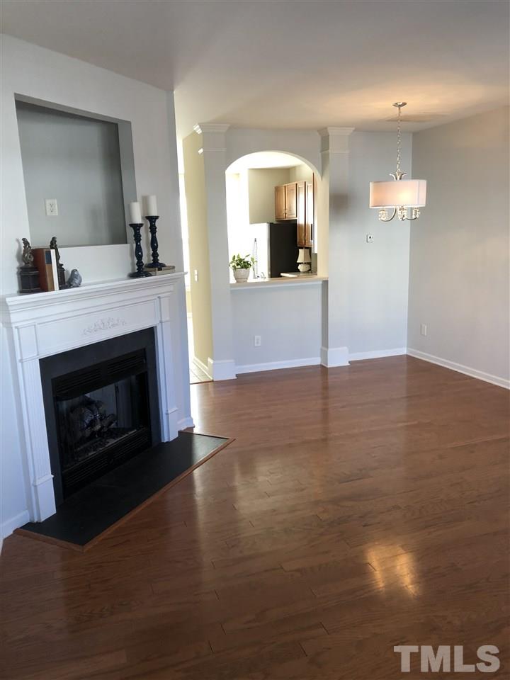 7857 Spungold Street Raleigh, NC 27617 - Photo 6 of 13 a view of a kitchen with a sink and a fireplace
