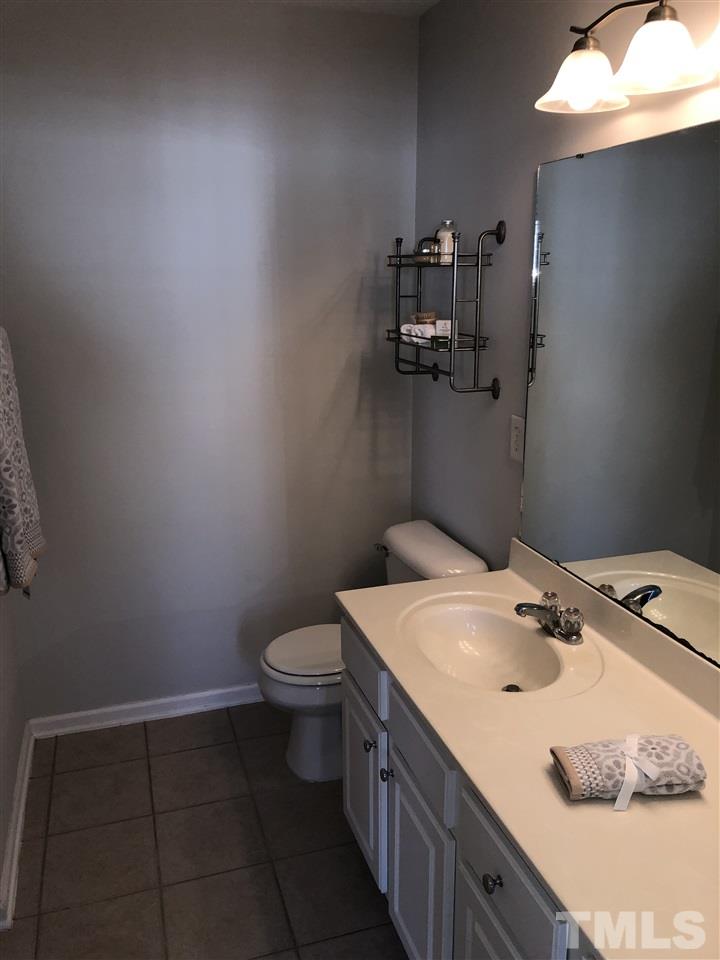7857 Spungold Street Raleigh, NC 27617 - Photo 8 of 13 a bathroom with a sink toilet and vanity