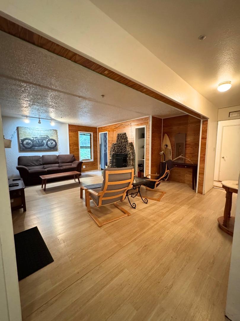 700 Laurel View Road Los Gatos, CA 95033 - Photo 12 of 21 a living room with furniture and a flat screen tv