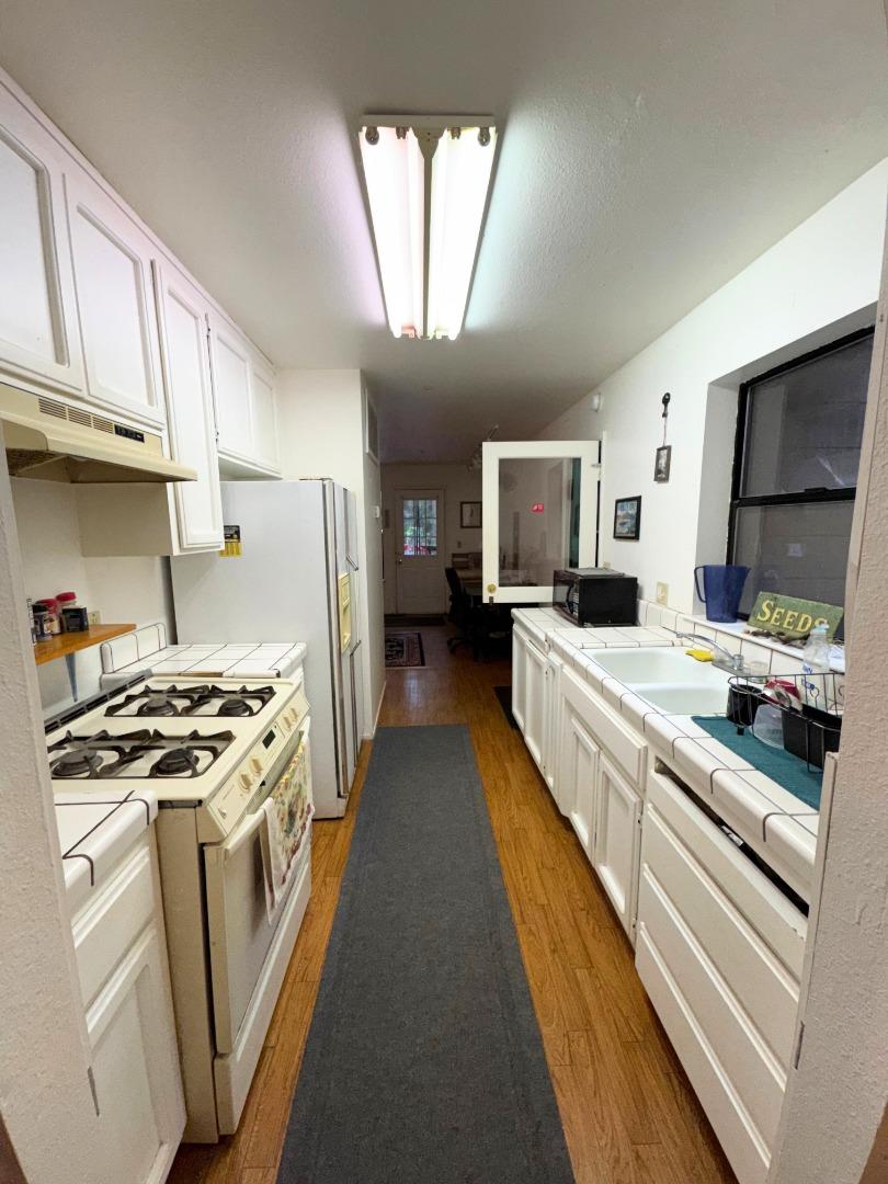 700 Laurel View Road Los Gatos, CA 95033 - Photo 13 of 21 a kitchen with stainless steel appliances granite countertop a stove a sink and a refrigerator