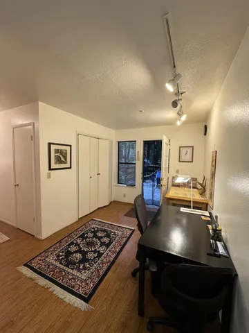 a room with furniture pool table and flat screen tv