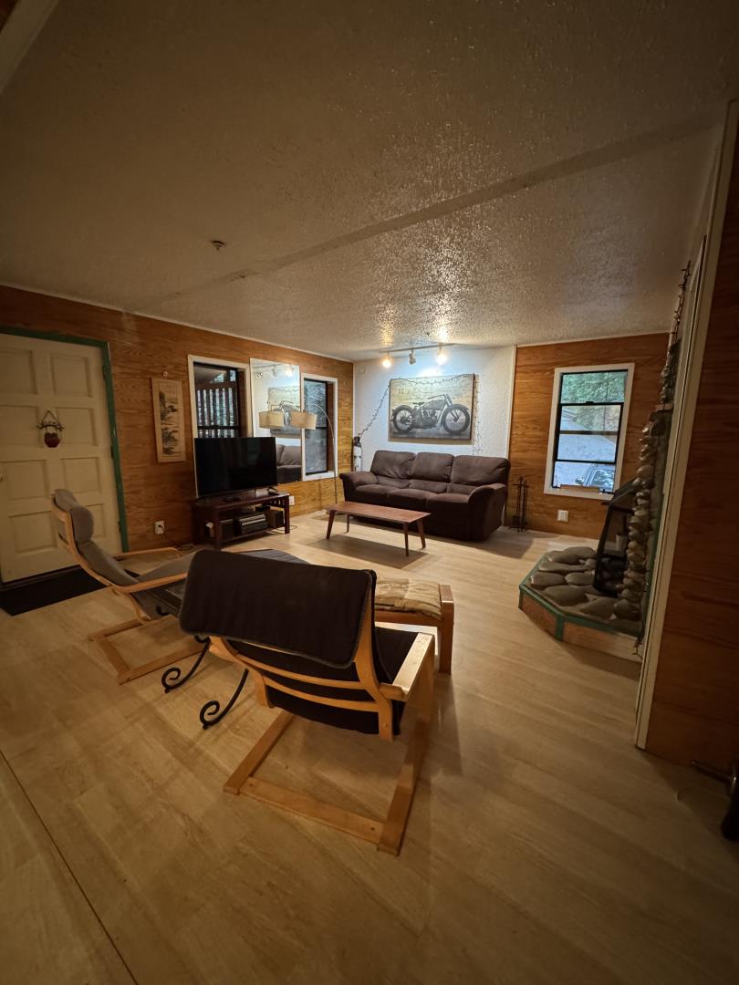 700 Laurel View Road Los Gatos, CA 95033 - Photo 17 of 21 a living room with furniture and a flat screen tv