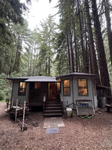 a view of house with backyard space and sitting area