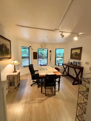 a view of a livingroom with furniture and a rug