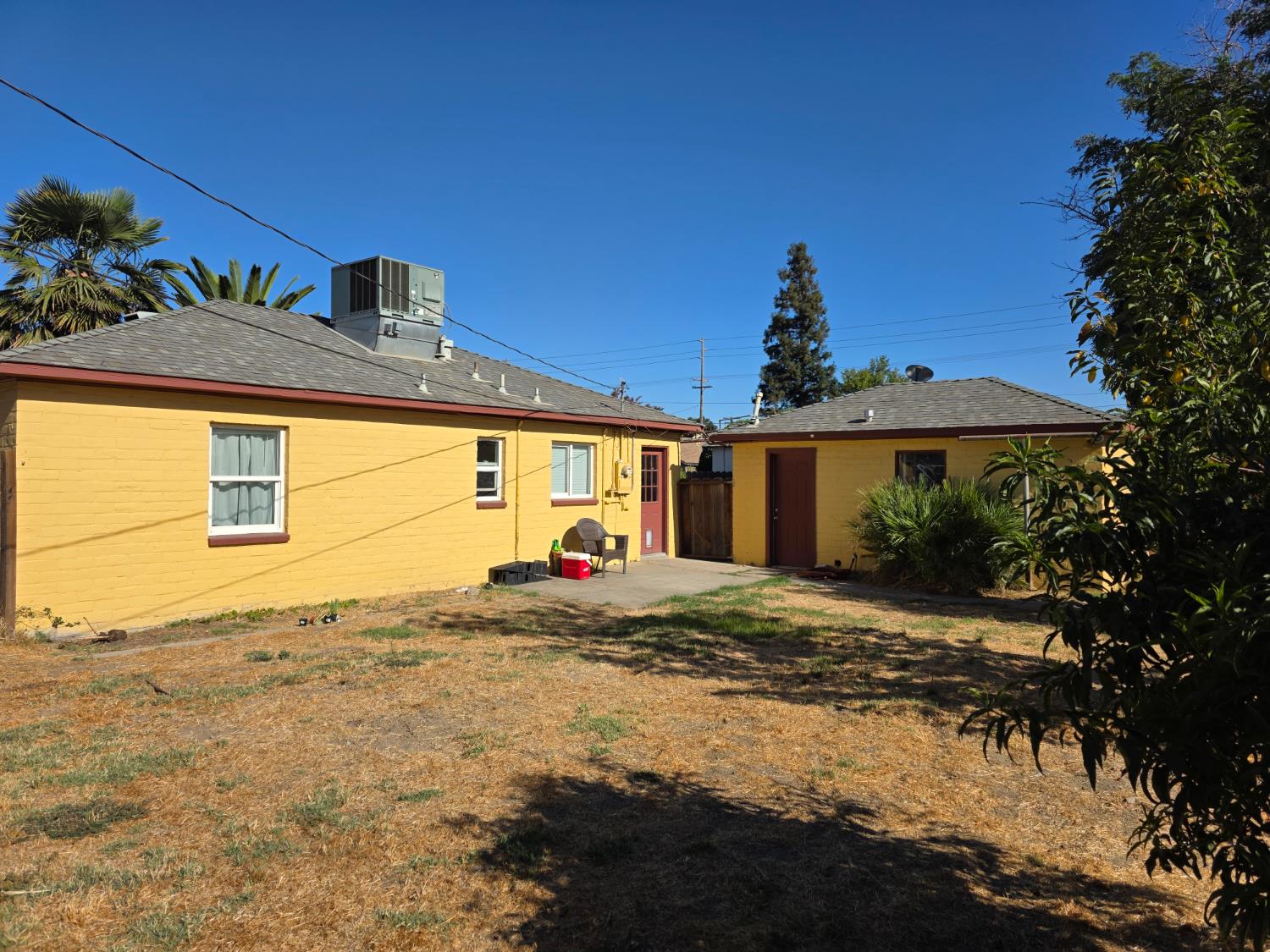 1512 Swalls Lane Modesto, CA 95358 - Photo 11 of 18 a front view of a house with a yard