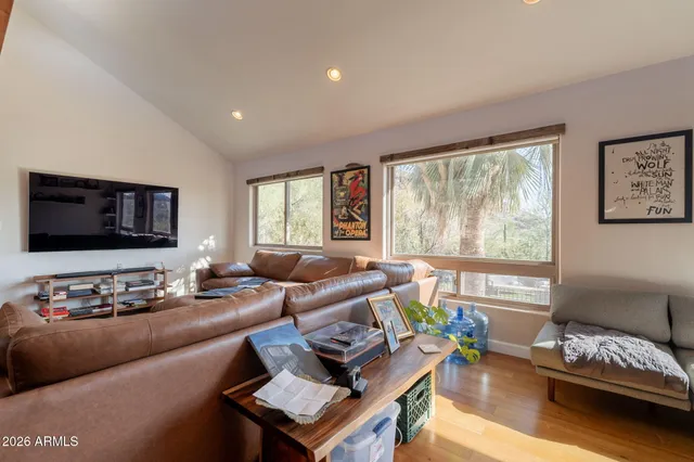 a view of an entryway with wooden floor