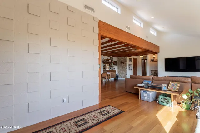 a kitchen with stainless steel appliances granite countertop a refrigerator a stove and a wooden floors