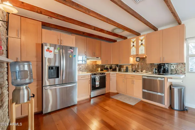 a living room with fireplace furniture and a flat screen tv