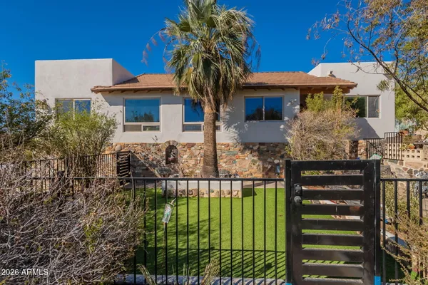 a front view of a house with garden
