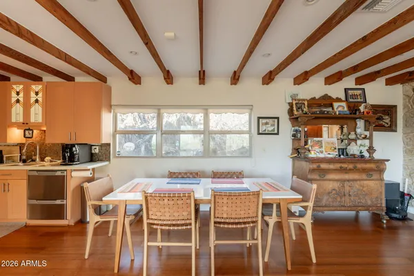a bathroom with a double vanity sink toilet and shower