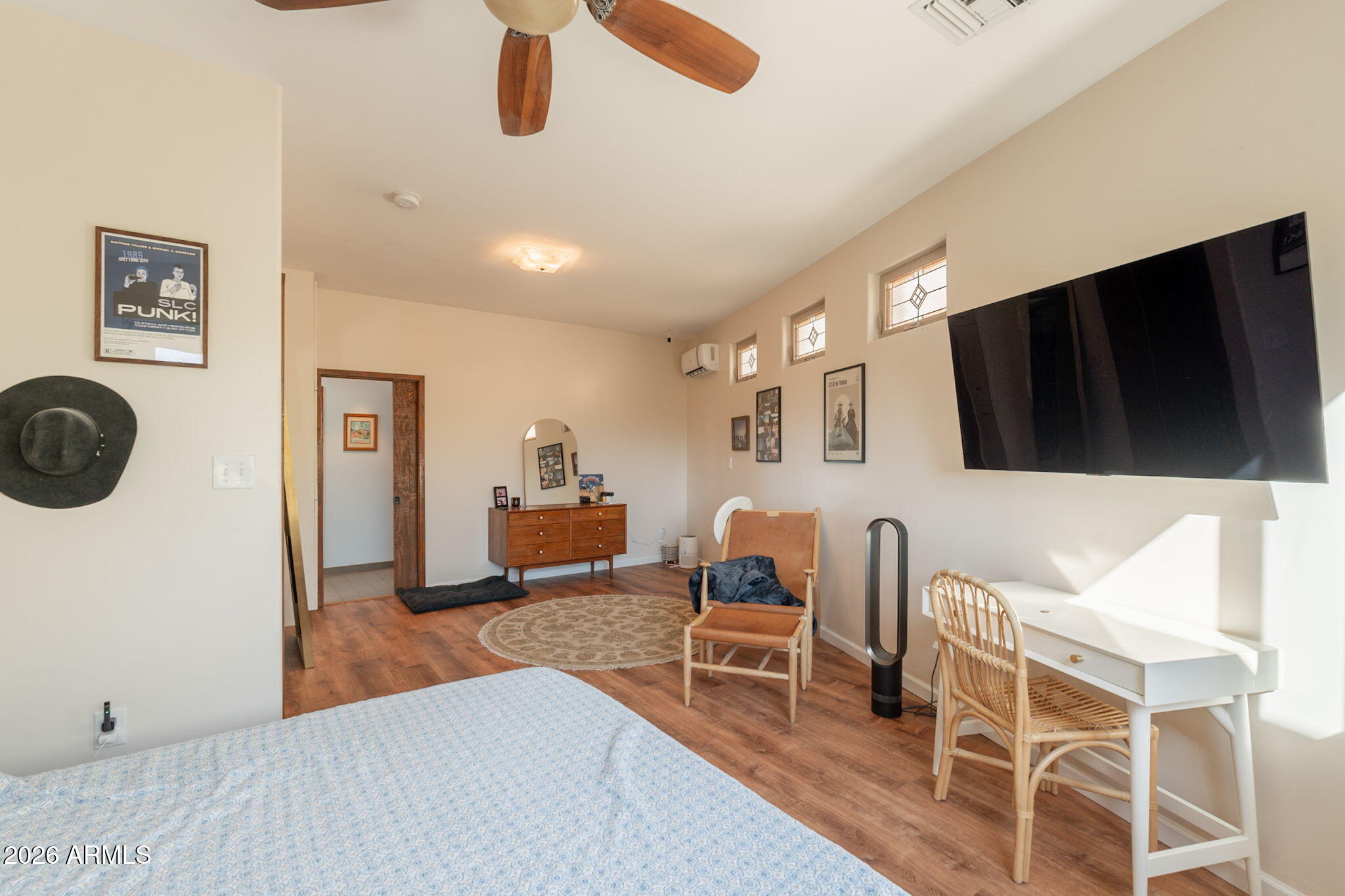 1902 East Cortez Street Phoenix, AZ 85020 - Photo 34 of 60 a living room with furniture a flat screen tv and kitchen view